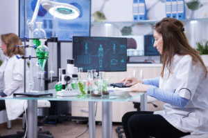 female-scientist-typing-her-computer-data-from-last-scientific-tests-chemistry-lab-1-scaled